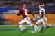 MIAMI, FL - DECEMBER 29: DeVonta Smith #6 of the Alabama Crimson Tide rushes in the first quarter against the defense of Tre Brown #6 of the Oklahoma Sooners during the College Football Playoff Semifinal at the Capital One Orange Bowl at Hard Rock Stadium