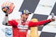 Mission Winnow Ducati's Italian rider Andrea Dovizioso (1st) celebrates on the podium after the Austrian Moto GP Grand Prix in Spielberg on August 11, 2019. (Photo by Johann GRODER / various sources / AFP) / Austria OUT / SOUTH TYROL OUT (Photo cre