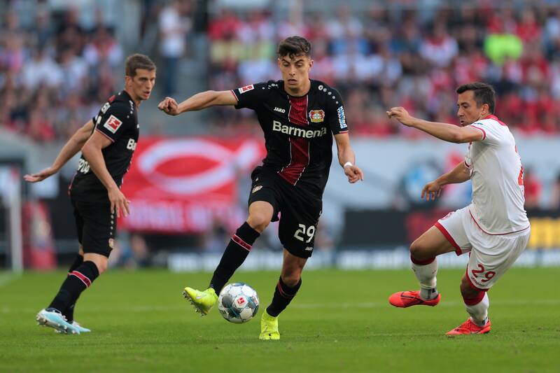 DUESSELDORF, GERMANY - AUGUST 24 : Lars Bender of Bayer 04 Leverkusen, Kai Havertz of Bayer 04 Leverkusen and Markus Suttner of Fortuna Duesseldorf battle for the ball during the Bundesliga match between Fortuna Duesseldorf and Bayer 04 Leverkusen at Merk