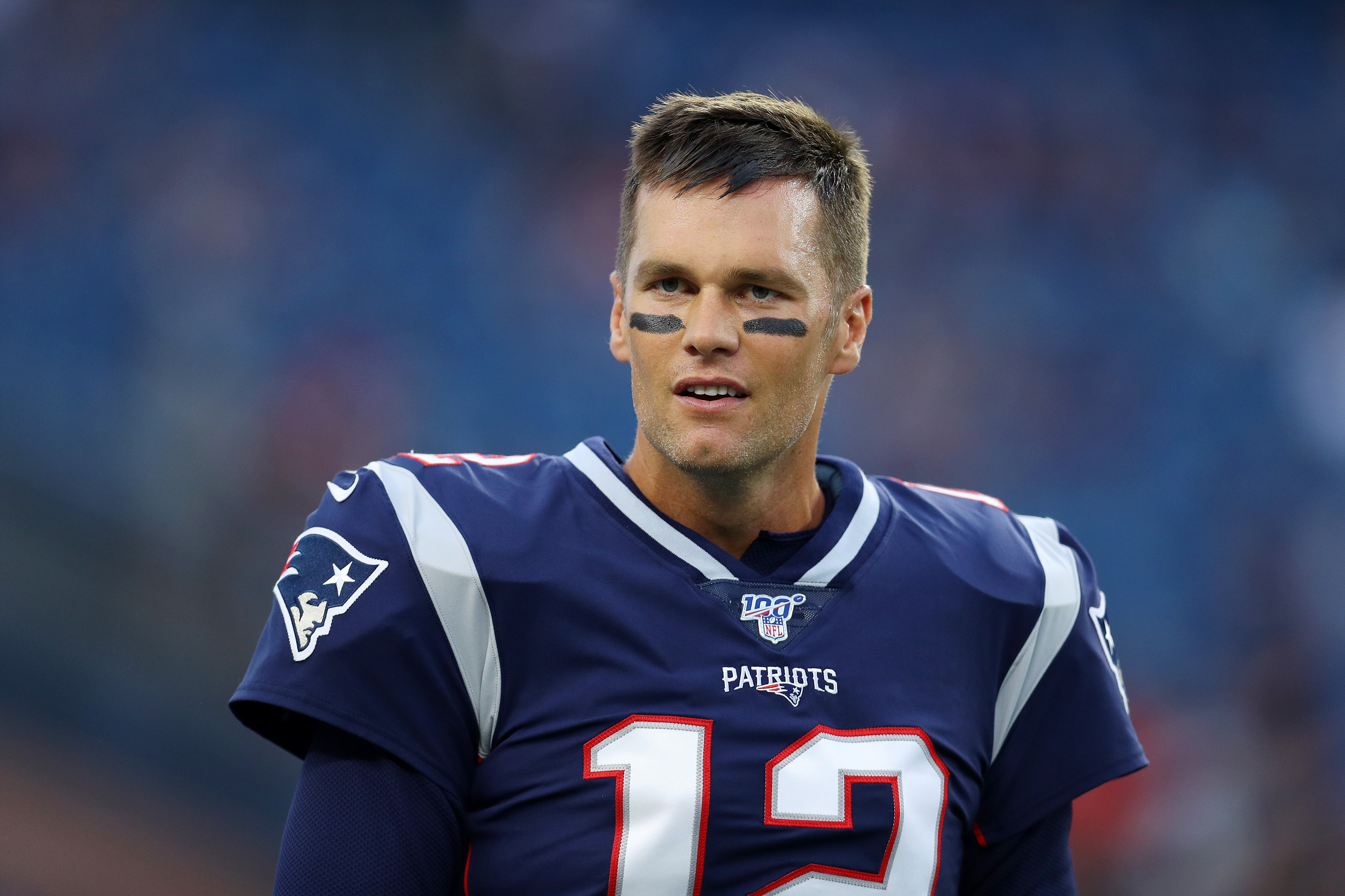 FOXBOROUGH, MASSACHUSETTS - AUGUST 22: Tom Brady #12 of the New England Patriots looks on during the preseason game between the Carolina Panthers and the New England Patriots at Gillette Stadium on August 22, 2019 in Foxborough, Massachusetts. (Photo by M