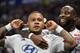 Lyon's Dutch forward Memphis Depay (C) is congratuled by teamate Lyon's French forward Moussa Dembele (R) after scoring a goal celebrates after scoring a goal during the French L1 football match between Olympique Lyonnais (OL) and Angers SCO on August 16,