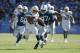 CARSON, CALIFORNIA - SEPTEMBER 08: Austin Ekeler #30 of the Los Angeles Chargers is pursued by Al-Quadin Muhammad #97 of the Indianapolis Colts in overtime at Dignity Health Sports Park on September 08, 2019 in Carson, California. The Chargers defeated th