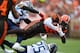 CLEVELAND, OH - SEPTEMBER 08: David Njoku #85 of the Cleveland Browns is brought down after a catch in the first quarter by Kenny Vaccaro #24 of the Tennessee Titans and Adoree' Jackson #25 of the Tennessee Titans at FirstEnergy Stadium on September 08,