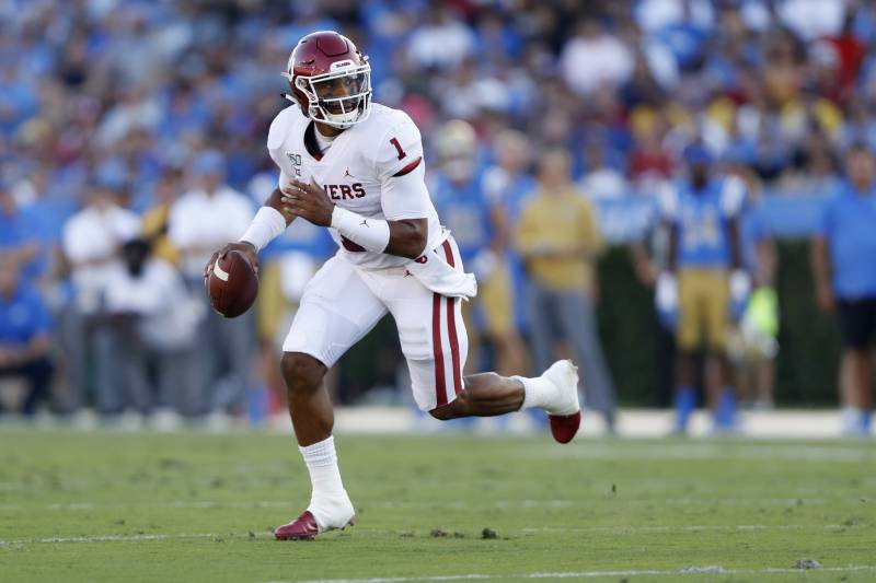 LOS ANGELES, CALIFORNIA - SEPTEMBER 14:  Jalen Hurts #1 of the Oklahoma Sooners breaks free from the pocket on a run during the firt half of a game against the UCLA Bruins at the Rose Bowl on September 14, 2019 in Los Angeles, California. (Photo by Sean M