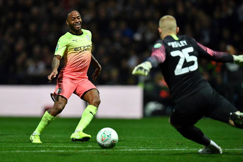 Manchester City's English midfielder Raheem Sterling (L) vies with Preston's English goalkeeper Connor Ripley during the English League Cup third round football match between Preston North End and Manchester City at the Deepdale stadium in northwest Engla