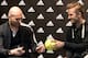 Paris Saint-Germain's (PSG) English midfielder David Beckham (R) and French former international player Zinedine Zidane signs autographs in a store of their sponsor on the Champs-Elysees avenue in Paris, on February 28, 2013. Beckham and Zidane have autog