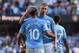 Manchester City's Belgian midfielder Kevin De Bruyne (R) celebrates with Manchester City's Argentinian striker Sergio Aguero after scoring his team's eighth goal during the English Premier League football match between Manchester City and Watford at the E