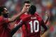 Liverpool's Senegalese striker Sadio Mane (R) celebrates with teammates Liverpool's Egyptian midfielder Mohamed Salah (L) and Liverpool's Brazilian midfielder Roberto Firmino after scoring a goal during the UEFA Super Cup 2019 football match between FC Li