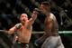 Robert Whittaker (left) and Adesanya
