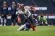 CHICAGO, ILLINOIS - SEPTEMBER 29: David Montgomery #32 of the Chicago Bears runs with the ball while being tackled by Xavier Rhodes #29 of the Minnesota Vikings in the third quarter at Soldier Field on September 29, 2019 in Chicago, Illinois. (Photo by D