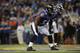 BALTIMORE, MD - AUGUST 23: Inside linebacker Arthur Brown #59 of the Baltimore Ravens defends during a preseason game against the Washington Redskins at M&T Bank Stadium on August 23, 2014 in Baltimore, Maryland. (Photo by Larry French/Getty Images)