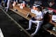 LOS ANGELES, CALIFORNIA - OCTOBER 09: Walker Buehler #21 of the Los Angeles Dodgers sits in the dug out before pitching in the seventh inning of game five of the National League Division Series against the Washington Nationals at Dodger Stadium on October