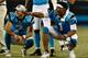 CHARLOTTE, NC - AUGUST 17: Cam Newton #1 and teammate Kyle Allen #7 of the Carolina Panthers react after a third quarter touchdown against the Miami Dolphins during the game at Bank of America Stadium on August 17, 2018 in Charlotte, North Carolina. (Ph