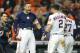 HOUSTON, TEXAS - OCTOBER 13: Carlos Correa #1 of the Houston Astros celebrates hitting a walk-off solo home run during the eleventh inning against the New York Yankees to win game two of the American League Championship Series 3-2 at Minute Maid Park on O