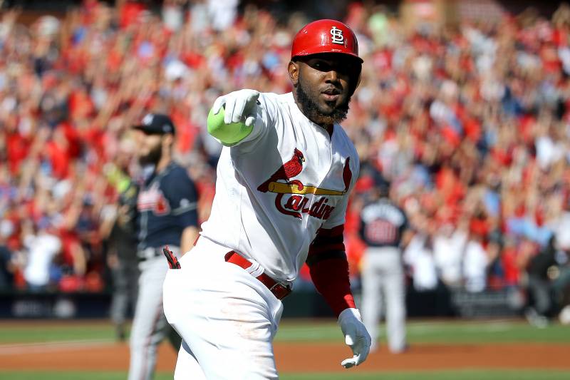 ST LOUIS, MISSOURI - OCTOBER 07:  Marcell Ozuna #23 of the St. Louis Cardinals celebrates after hitting a solo home run against the Atlanta Braves during the first inning in game four of the National League Division Series at Busch Stadium on October 07, 