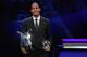 TOPSHOT - Liverpool's Dutch defender Virgil van Dijk poses with his trophies of Best Men's player in Europe of the Year and Best Defender at the end of the UEFA Champions League football group stage draw ceremony in Monaco on August 29, 2019. (Photo by Va