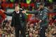 Manchester United's Norwegian manager Ole Gunnar Solskjaer (L) and Liverpool's German manager Jurgen Klopp (R) gesture on the touchline during the English Premier League football match between Manchester United and Liverpool at Old Trafford in Manchester,
