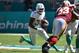 MIAMI, FL - OCTOBER 13: Kenyan Drake #32 of the Miami Dolphins rushes the football during the first half against the Washington Redskins at Hard Rock Stadium on October 13, 2019 in Miami, Florida. (Photo by Eric Espada/Getty Images)