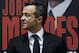 Portuguese football manager Jorge Mendes stand in front of the book