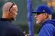 CHICAGO, IL - OCTOBER 18: Former Chicago Cubs player David Ross meets with manager Joe Maddon of the Chicago Cubs before game four of the National League Championship Series against the Los Angeles Dodgers at Wrigley Field on October 18, 2017 in Chicago,
