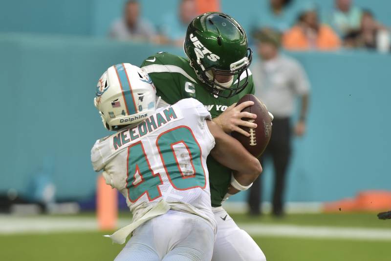 MIAMI, FL - NOVEMBER 03: Nik Needham #40 of the Miami Dolphins sacks Sam Darnold #14 of the New York Jets during the fourth quarter of the game at Hard Rock Stadium on November 3, 2019 in Miami, Florida. (Photo by Eric Espada/Getty Images)