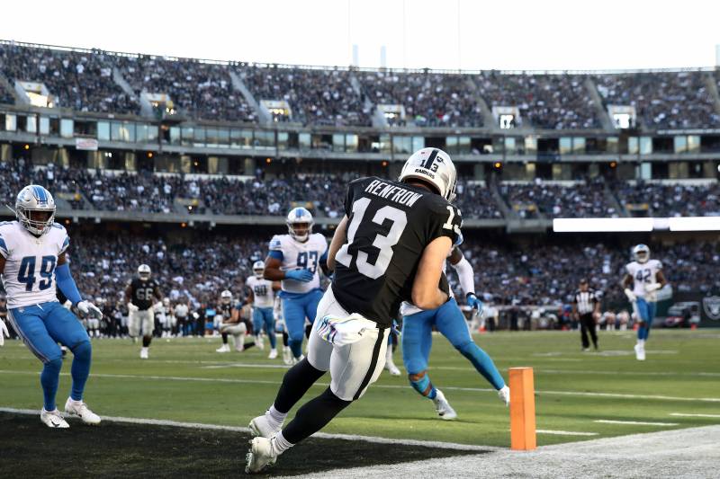 OAKLAND, CALIFORNIA - NOVEMBER 03:   Hunter Renfrow #13 of the Oakland Raiders makes the winning touchdown catch thrown by Derek Carr #4 against the Detroit Lions at RingCentral Coliseum on November 03, 2019 in Oakland, California. (Photo by Ezra Shaw/Get