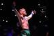 LAS VEGAS, NEVADA - DECEMBER 12: Conor McGregor of Ireland is introduced to the crowd before facing Jose Aldo of Brazil in their featherweight championship bout during the UFC 194 event inside MGM Grand Garden Arena on December 12, 2015 in Las Vegas, Nev