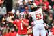 COLUMBUS, OH - NOVEMBER 9: Quarterback Justin Fields #1 of the Ohio State Buckeyes passes over the defense of Oluwaseun Oluwatimi #52 of the Maryland Terrapins in the first quarter at Ohio Stadium on November 9, 2019 in Columbus, Ohio. (Photo by Jamie S