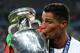 PARIS, FRANCE - JULY 10: Cristiano Ronaldo of Portugal kisses the trophy following the UEFA Euro 2016 Final match between Portugal and France at Stade de France on July 10, 2016 in Paris, France. (Photo by Chris Brunskill Ltd/Getty Images)