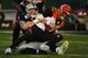 OAKLAND, CALIFORNIA - NOVEMBER 17: Maxx Crosby #98 of the Oakland Raiders sacks Ryan Finley #5 of the Cincinnati Bengals during their NFL game at RingCentral Coliseum on November 17, 2019 in Oakland, California. (Photo by Robert Reiners/Getty Images)