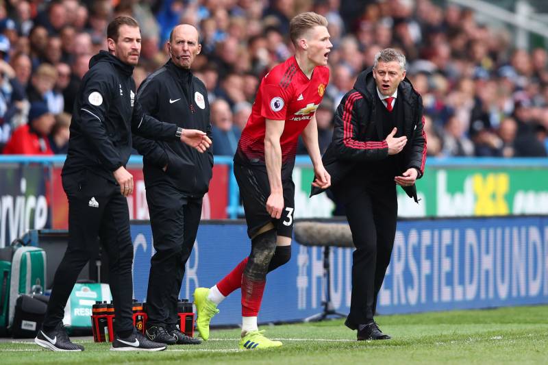 HUDDERSFIELD, ENGLAND - MAY 05: Ole Gunnar Solskjaer, Manager of Manchester United gives intruction to Scott McTominay during the Premier League match between Huddersfield Town and Manchester United at John Smith's Stadium on May 05, 2019 in Huddersfield