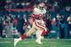 MIAMI, FL - NOVEMBER 20: Wide receiver Jerry Rice #80 of the San Francisco 49ers races upfield against the Miami Dolphins at Joe Robbie Stadium in Miami, Florida on November 20, 1995. The 49ers defeated the Dolphins 44-20. (Photo by Joseph Patronite/Gett