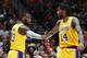 PORTLAND, OR - OCTOBER 18: LeBron James #23 and Brandon Ingram #14 of the Los Angeles Lakers celebrate in the first quarter against the Portland Trail Blazers during their game at Moda Center on October 18, 2018 in Portland, Oregon. NOTE TO USER: User ex