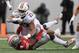 COLUMBUS, OH - OCTOBER 26: Jonathan Taylor #23 of the Wisconsin Badgers is brought down by Jordan Fuller #4 of the Ohio State Buckeyes after picking up a first down in the first quarter at Ohio Stadium on October 26, 2019 in Columbus, Ohio. (Photo by Ja