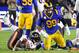 LOS ANGELES, CA - NOVEMBER 17: Defensive tackle Aaron Donald #99 of the Los Angeles Rams stops running back running back David Montgomery #32 of the Chicago Bears at the line of scrimmage age in the first half of the game at the Los Angeles Memorial Colis