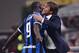 TOPSHOT - Inter Milan's Belgian forward Romelu Lukaku (L) embraces Inter Milan's Italian head coach Antonio Conte after scoring during the Italian Serie A football match AC Milan vs Inter Milan on September 21, 2019 at the San Siro stadium in Milan. (Phot