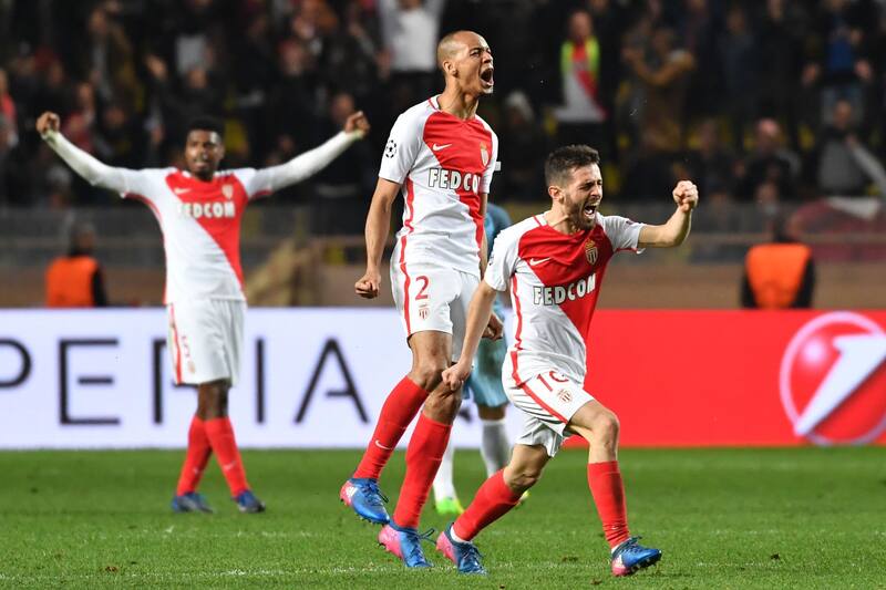 Monaco's Portuguese midfielder Bernardo Silva (R) and Monaco's Brazilian defender Fabinho celebrate at the end of the UEFA Champions League round of 16 football match between Monaco and Manchester City at the Stade Louis II in Monaco on March 15, 2017. /