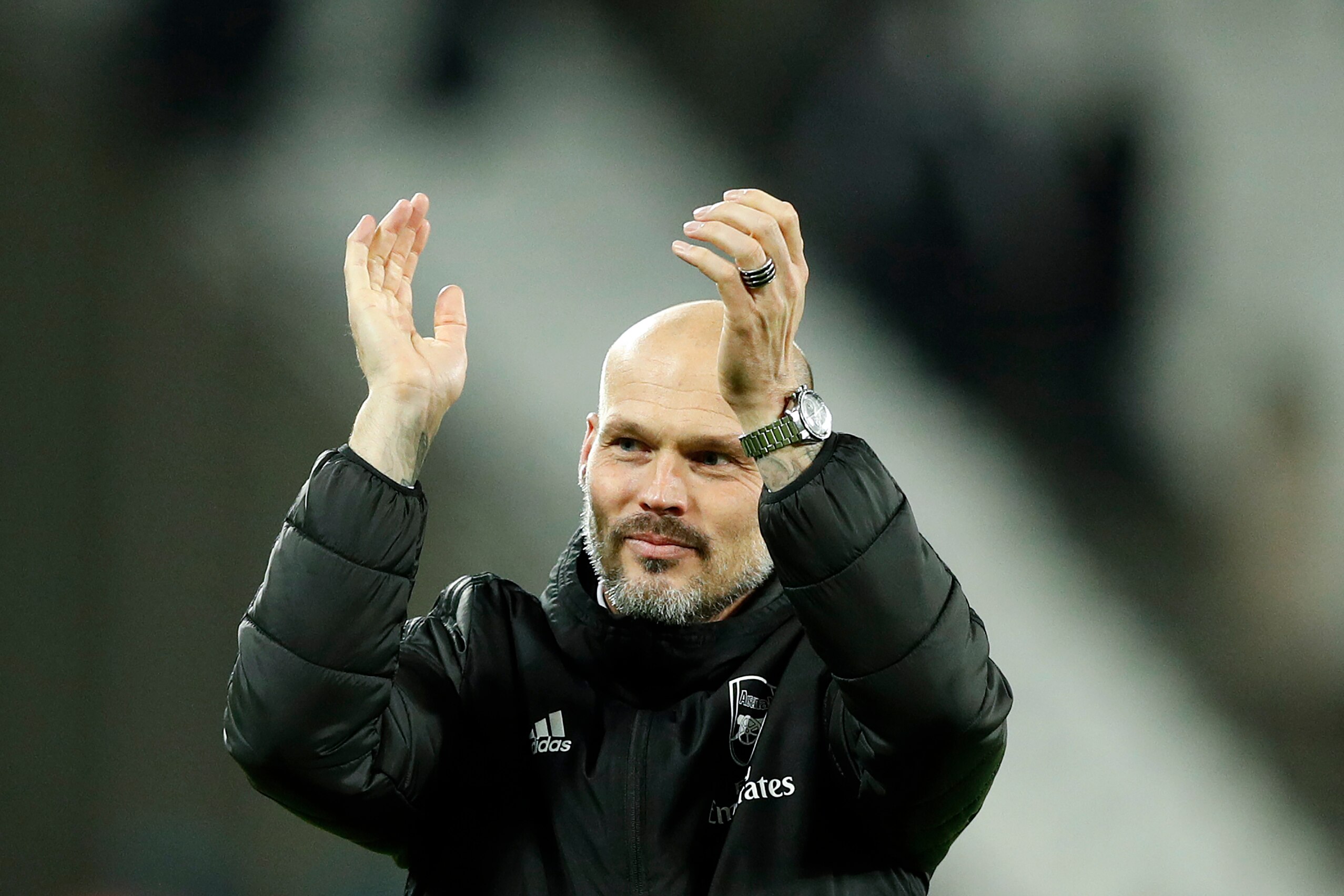Arsenal's Swedish Interim head coach Freddie Ljungberg applauds the fans following the English Premier League football match between West Ham United and Arsenal at The London Stadium, in east London on December 9, 2019. (Photo by Adrian DENNIS / AFP) / RE