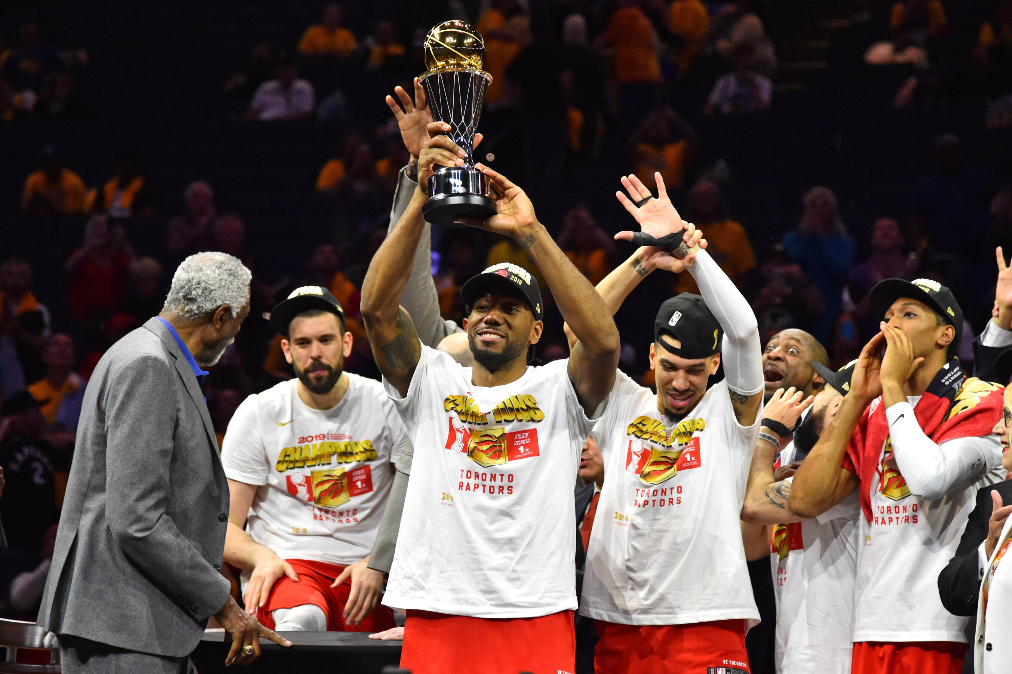 OAKLAND, CA - JUNE 13: Kawhi Leonard #2 of the Toronto Raptors hoists the Bill Russell MVP Trophy after defeating the Golden State Warriors in Game Six of the NBA Finals on June 13, 2019 at ORACLE Arena in Oakland, California. NOTE TO USER: User expressly
