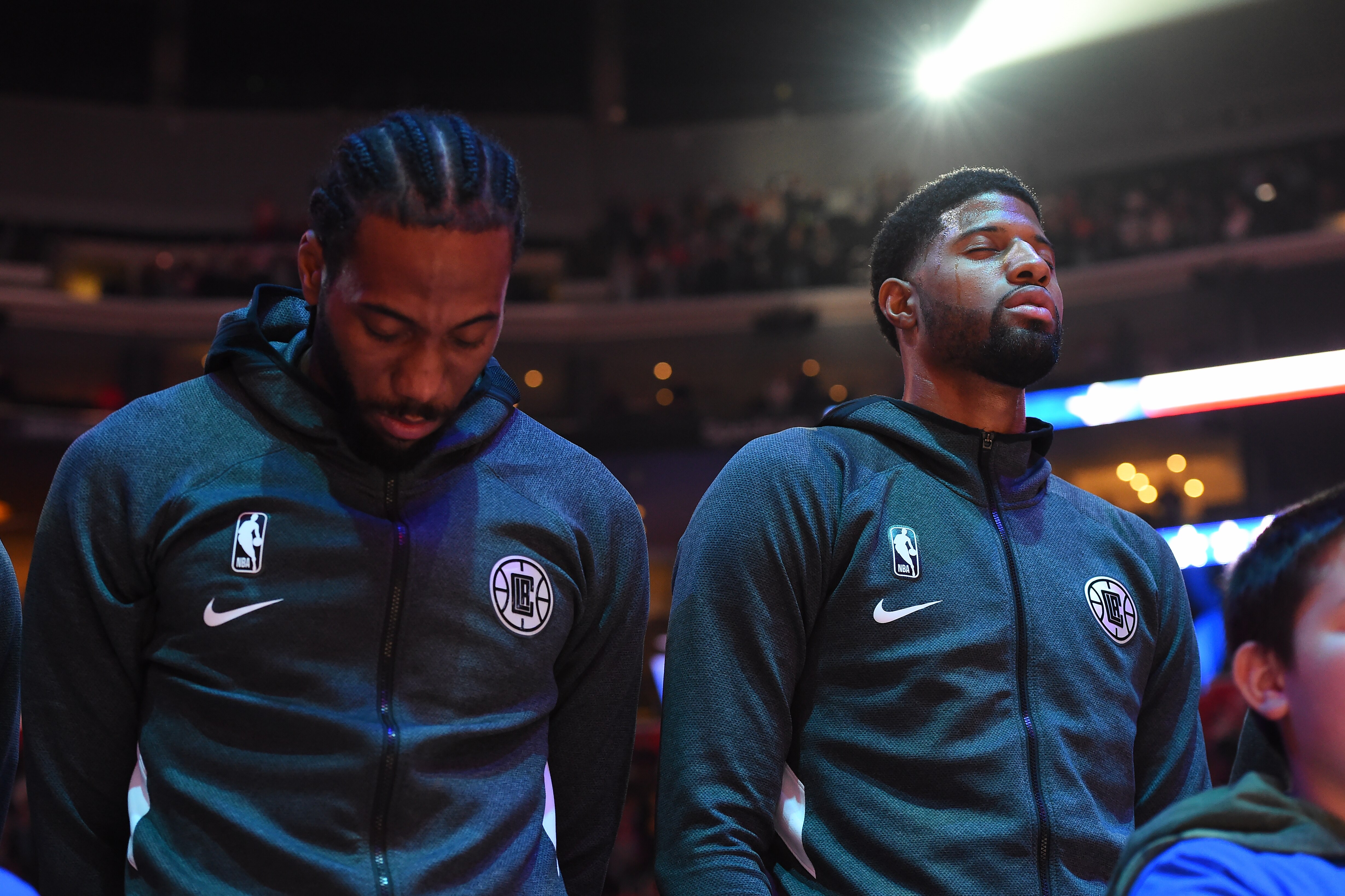 LOS ANGELES, CA - DECEMBER 3: Kawhi Leonard #2, and Paul George #13 of the LA Clippers stands for the National Anthem before the game against the Portland Trail Blazers on December 3, 2019 at STAPLES Center in Los Angeles, California. NOTE TO USER: User e