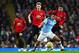 MANCHESTER, ENGLAND - DECEMBER 07: Rodrigo of Manchester City and Jesse Lingard and Scott Mctominay of Manchester United in action during the Premier League match between Manchester City and Manchester United at Etihad Stadium on December 07, 2019 in Ma