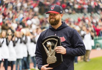 CLEVELAND, OH - APRIL 6: Corey Kluber #28 of the Cleveland Indians receives his 2017 Cy Young award prior to the game against the Kansas City Royals at Progressive Field on April 6, 2018 in Cleveland, Ohio. The Indians defeated the Royals 3-2. (Photo by J