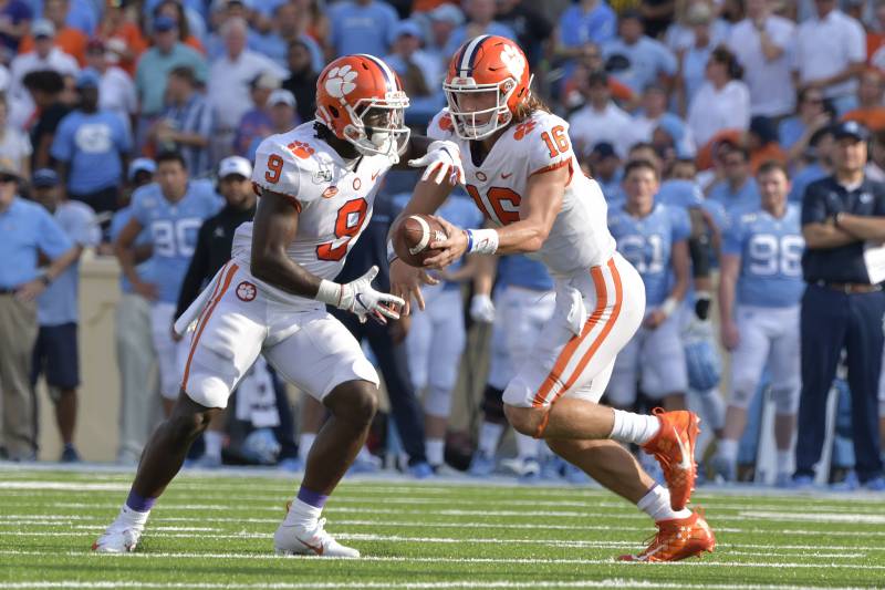 Though his numbers suggest he should be one of college football's biggest stars, Travis Etienne is comfortable playing more of a complementary role to quarterback Trevor Lawrence at Clemson.