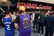 LOS ANGELES, CALIFORNIA - OCTOBER 22: Friends and fans of Kawhi Leonard #2 of the LA Clippers and LeBron James #23 of the Los Angeles Lakers wait in line for the LA Clippers season opening game against the Los Angeles Lakers at Staples Center on October