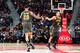 ATLANTA, GA - JANUARY 14: John Collins #20, and Trae Young #11 of the Atlanta Hawks hi-five each other during the game against the Phoenix Suns on January 14, 2020 at State Farm Arena in Atlanta, Georgia. NOTE TO USER: User expressly acknowledges and agr
