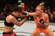 LOS ANGELES, CA - FEBRUARY 28: (R) Holly Holm punches Raquel Pennington in their women's bantamweight bout during the UFC 184 event at Staples Center on February 28, 2015 in Los Angeles, California. (Photo by Josh Hedges/Zuffa LLC/Zuffa LLC via Getty Im