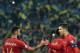 Portugal's forward Cristiano Ronaldo shakes hands with Portugal's midfielder Bruno Fernandes after the the Euro 2020 football qualification match between Ukraine and Portugal at the NSK Olimpiyskyi stadium in Kiev on October 14, 2019. (Photo by Genya SAVI