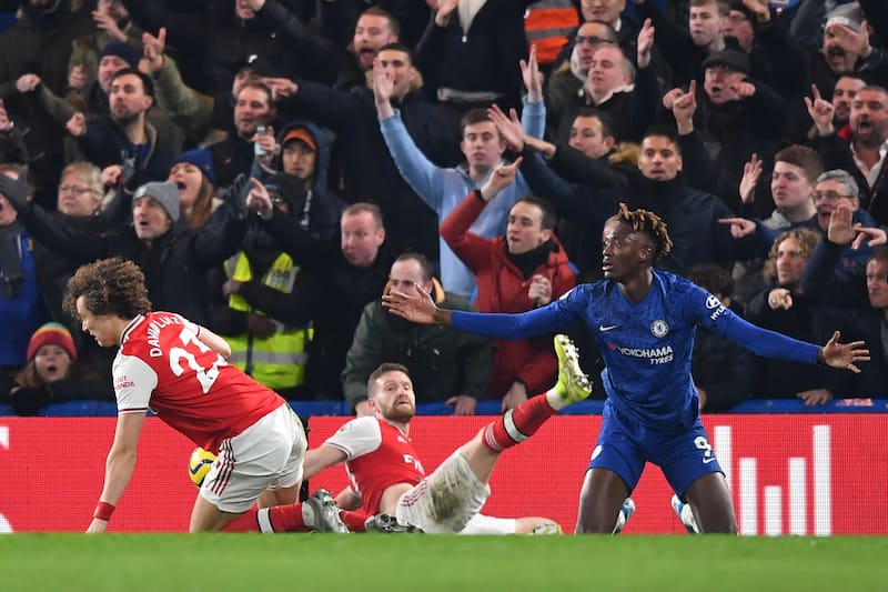 Chelsea's English striker Tammy Abraham (R) appeals after being fouled by Arsenal's Brazilian defender David Luiz (L) to win a penalty during the English Premier League football match between Chelsea and Arsenal at Stamford Bridge in London on January 21,