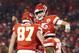 KANSAS CITY, MISSOURI - JANUARY 20: Patrick Mahomes #15 of the Kansas City Chiefs celebrates with Travis Kelce #87 after scoring a touchdown in the third quarter against the New England Patriots during the AFC Championship Game at Arrowhead Stadium on Jan