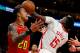 ATLANTA, GEORGIA - JANUARY 08:  John Collins #20 of the Atlanta Hawks battles for a rebound against Clint Capela #15 of the Houston Rockets in the second half at State Farm Arena on January 08, 2020 in Atlanta, Georgia.  NOTE TO USER: User expressly ackno